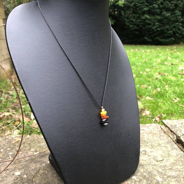 Amber & Jet adjustable necklace with upcycled headphone magnet